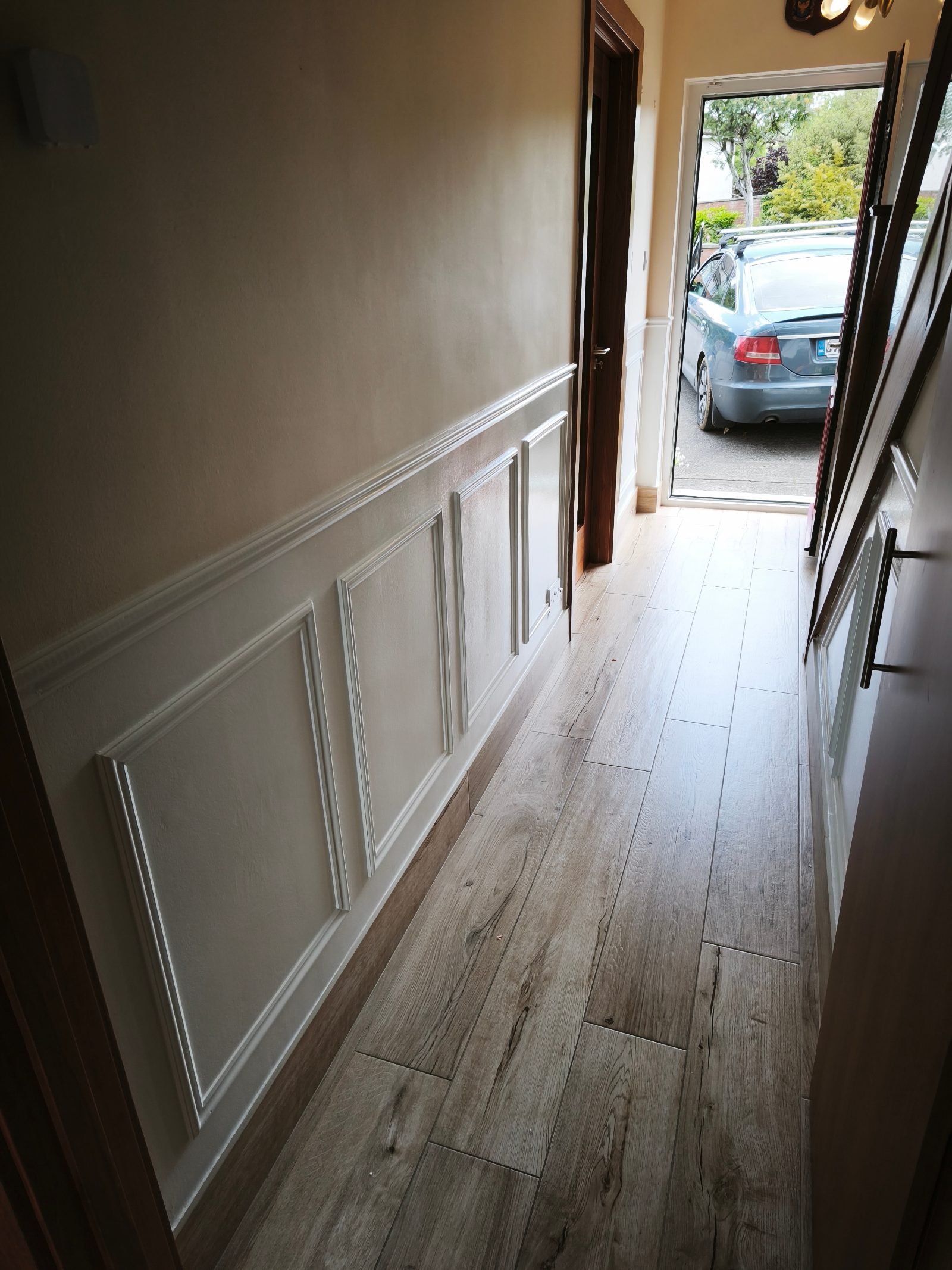 Cream wainscoting by a front door